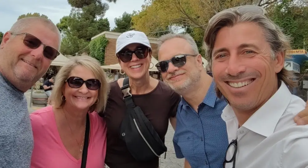 A group of tourists smiling during their tour in Pompei