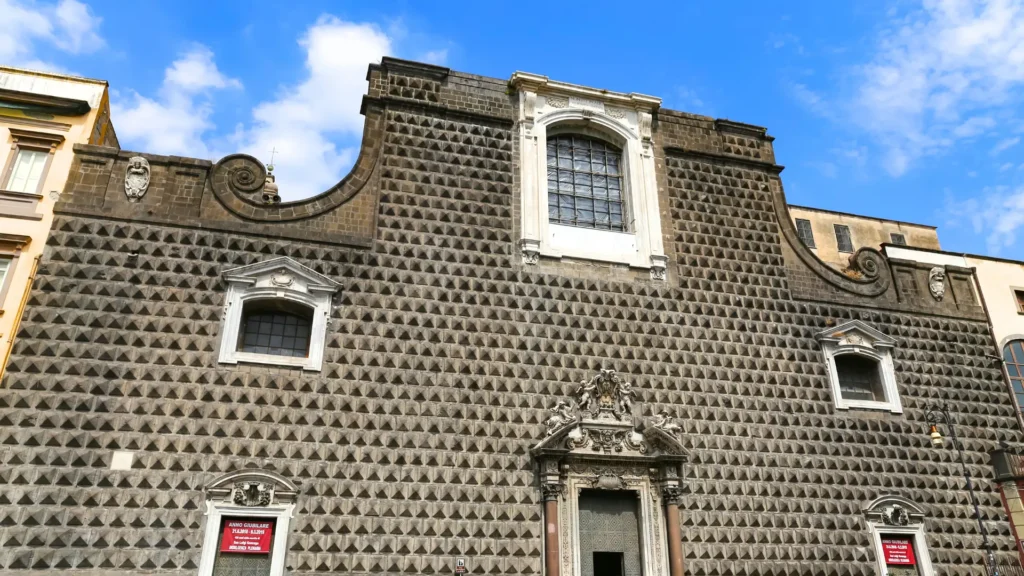 The facade of the Church of Gesù Nuovo in Naples, with its distinctive diamond-shaped ashlar stone design