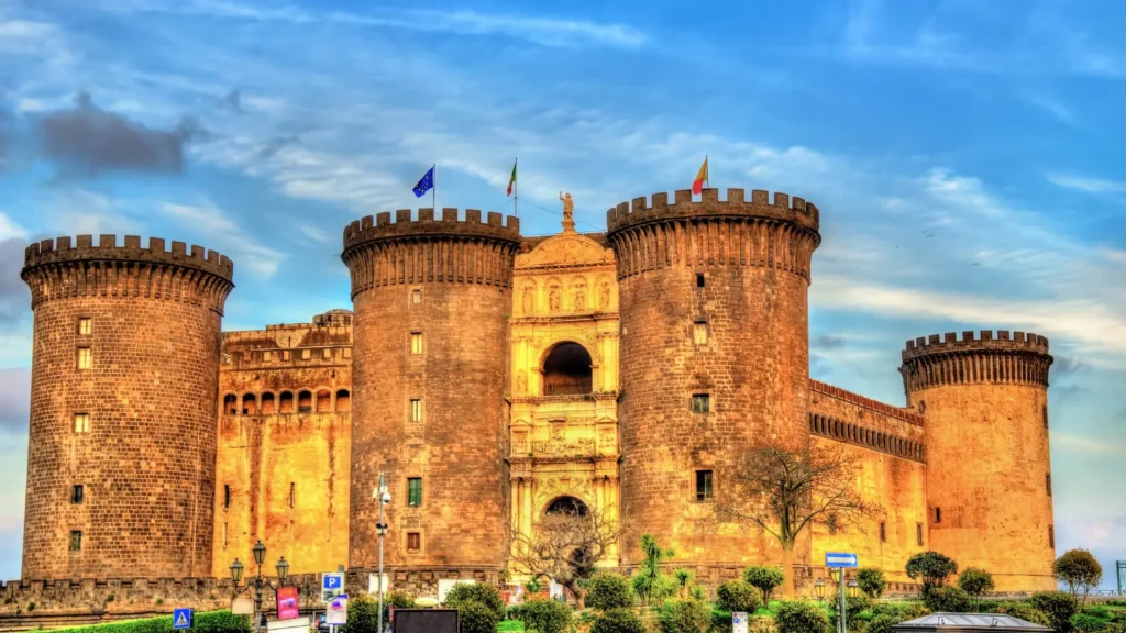 View of Castello Maschio Angioino in Naples, with the castle in full view and a beautiful sky behind