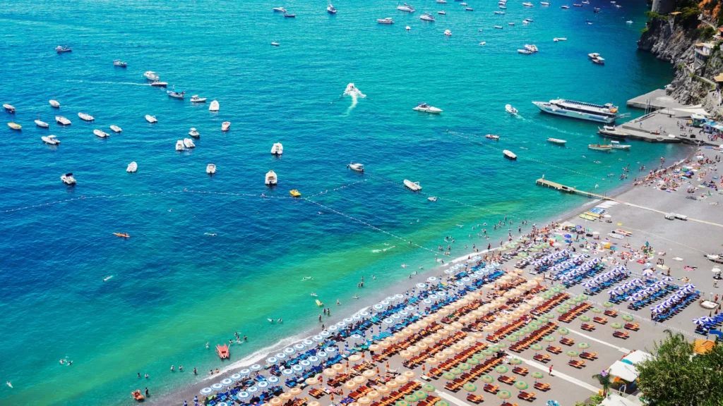 Spiaggia Grande in Positano, with its colorful beachfront and the iconic cliffside village