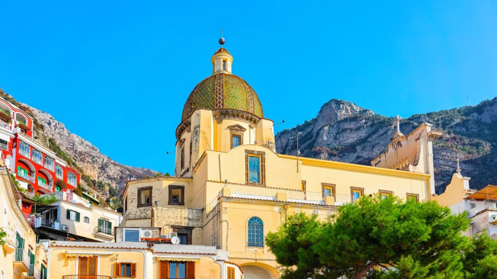 Church of Santa Maria Assunta in Positano, featuring its iconic dome covered in colorful majolica tiles