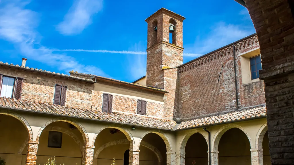 The Cloister of San Francesco in Sorrento, a medieval courtyard with elegant arches and lush greenery